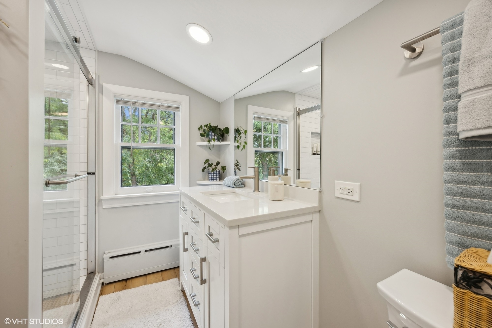 208 Woodside Road Riverside, IL 60546 - Photo 28 of 37 a view of bathroom with a sink and mirror next to a window