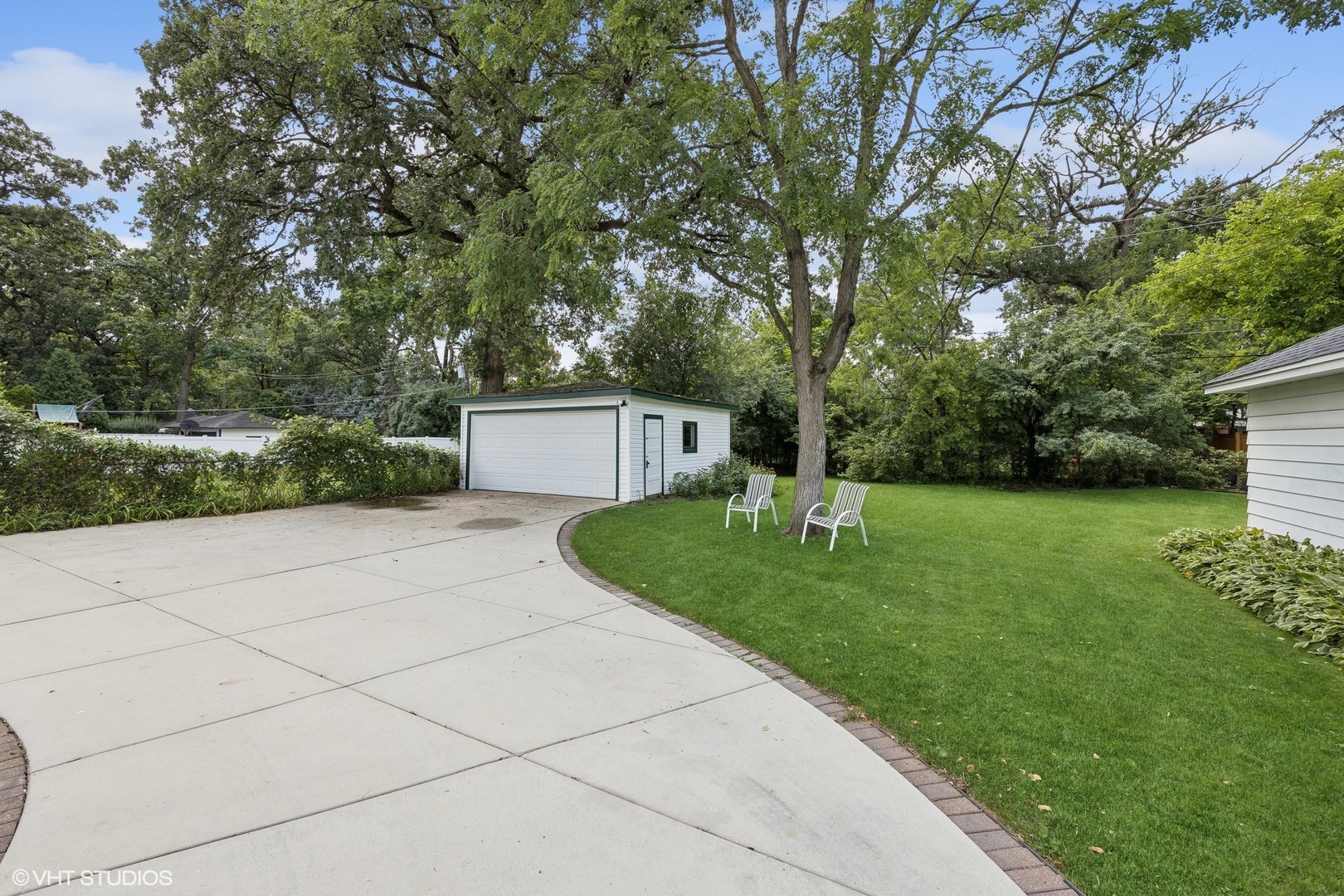 208 Woodside Road Riverside, IL 60546 - Photo 31 of 37 a front view of a house with a yard and trees