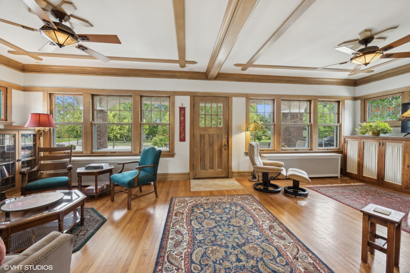 208 Woodside Road Riverside, IL 60546 - Photo 8 of 37 a living room with furniture a rug floor to ceiling windows and a dining table