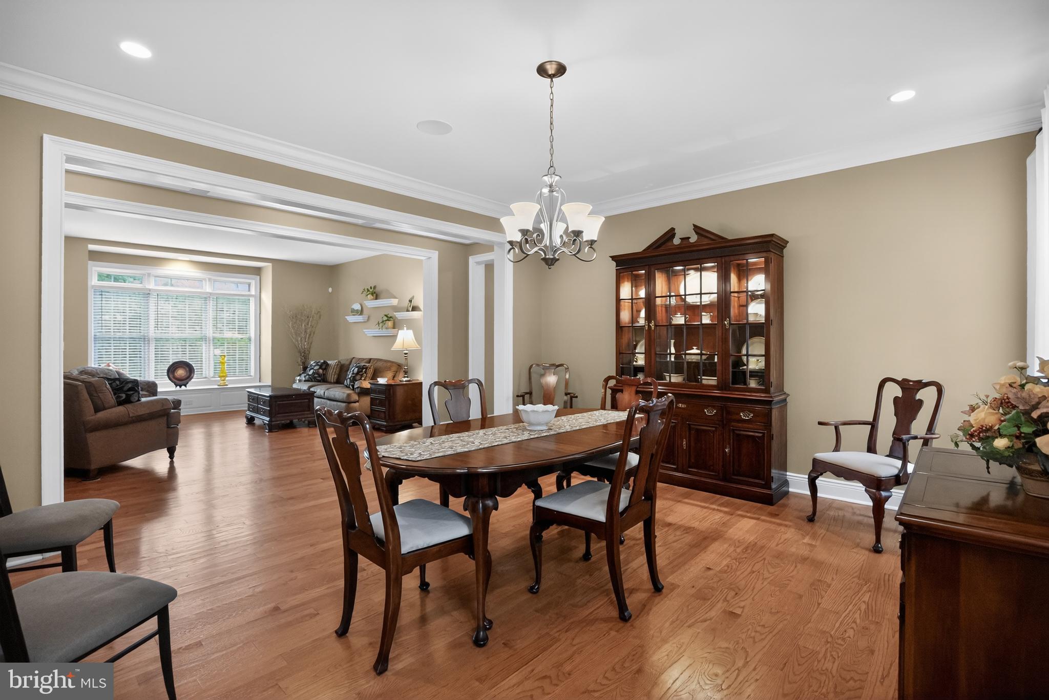 1031 Coates Road Jenkintown, PA 19046 - Photo 12 of 66 a dining room with furniture a chandelier and wooden floor