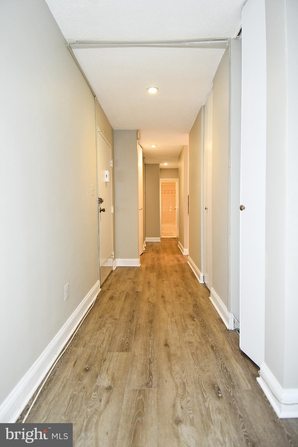 1301 South Arlington Ridge Road, Unit 110 Arlington, VA 22202 - Photo 16 of 45 a view of a big room with wooden floor and windows