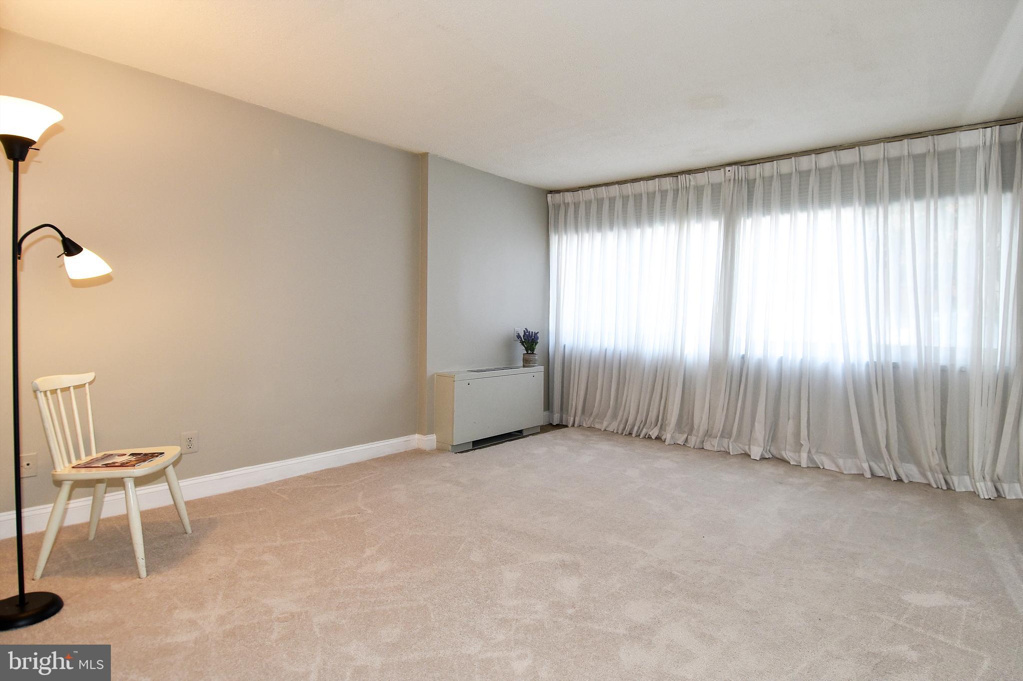 1301 South Arlington Ridge Road, Unit 110 Arlington, VA 22202 - Photo 19 of 45 a view of an empty room with a window