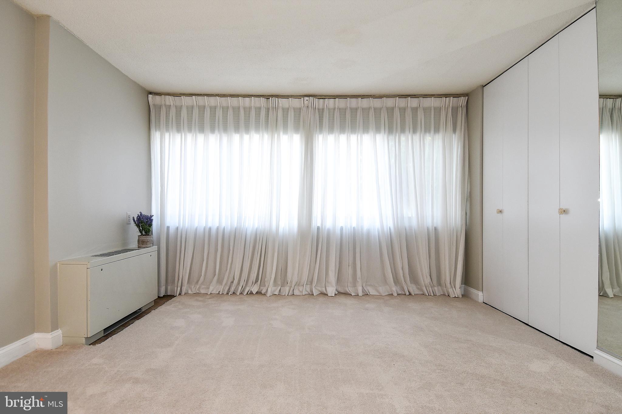 1301 South Arlington Ridge Road, Unit 110 Arlington, VA 22202 - Photo 20 of 45 an empty room with windows