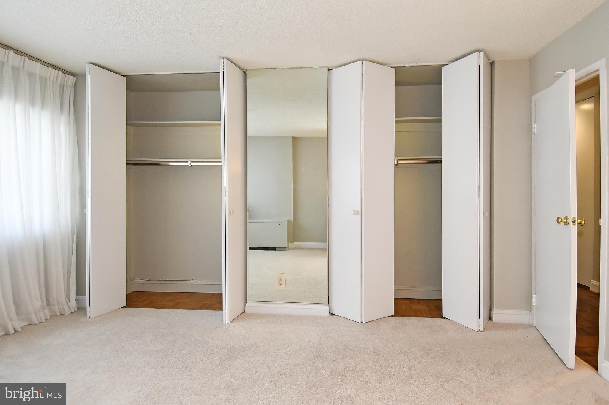 1301 South Arlington Ridge Road, Unit 110 Arlington, VA 22202 - Photo 22 of 45 a view of an empty room with closet and a window