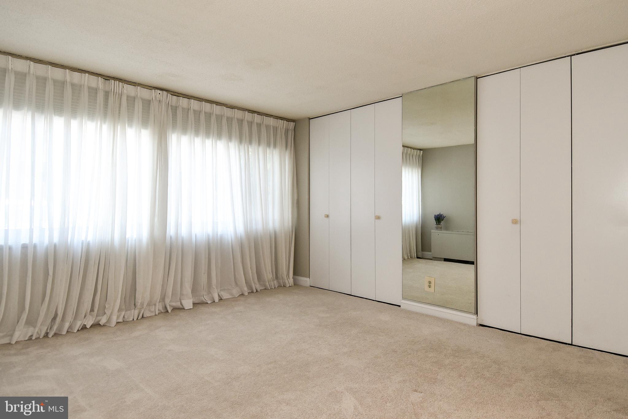 1301 South Arlington Ridge Road, Unit 110 Arlington, VA 22202 - Photo 23 of 45 a view of an empty room with a window