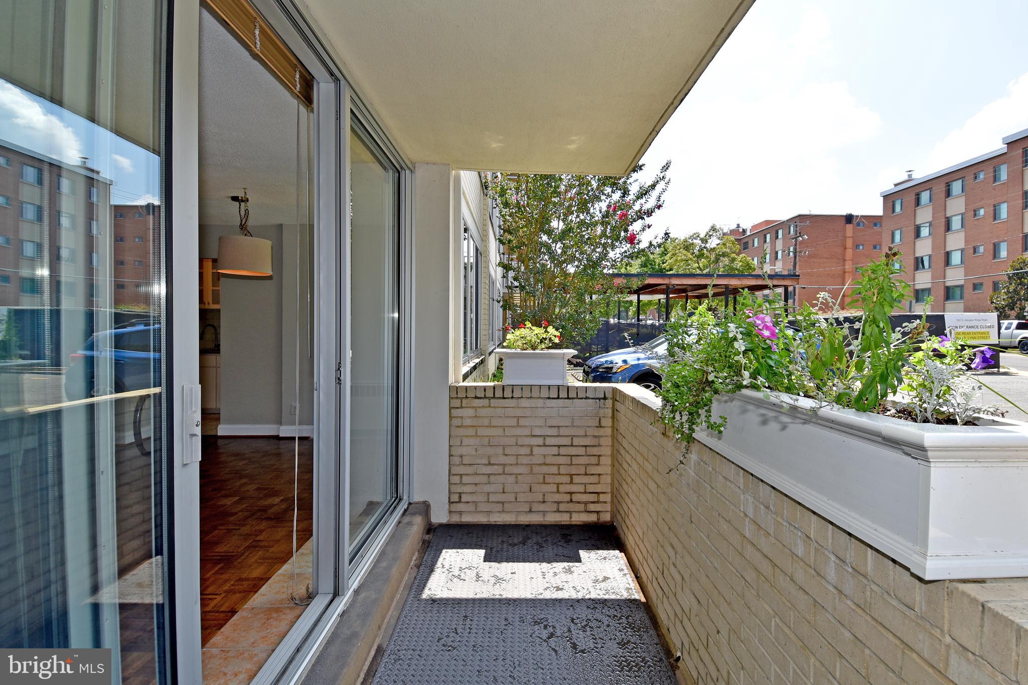1301 South Arlington Ridge Road, Unit 110 Arlington, VA 22202 - Photo 25 of 45 a porch with seating space