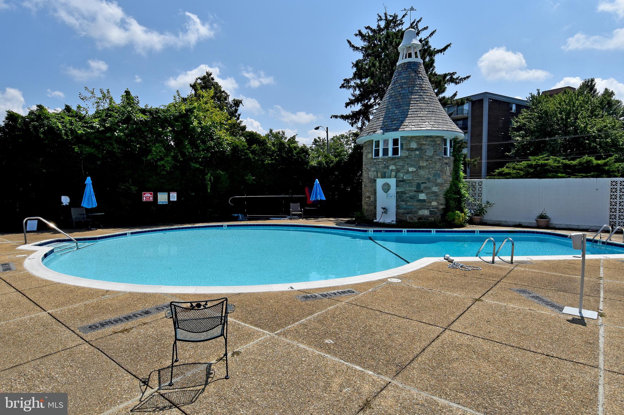 1301 South Arlington Ridge Road, Unit 110 Arlington, VA 22202 - Photo 27 of 45 a view of outdoor space pool seating area and barbeque oven