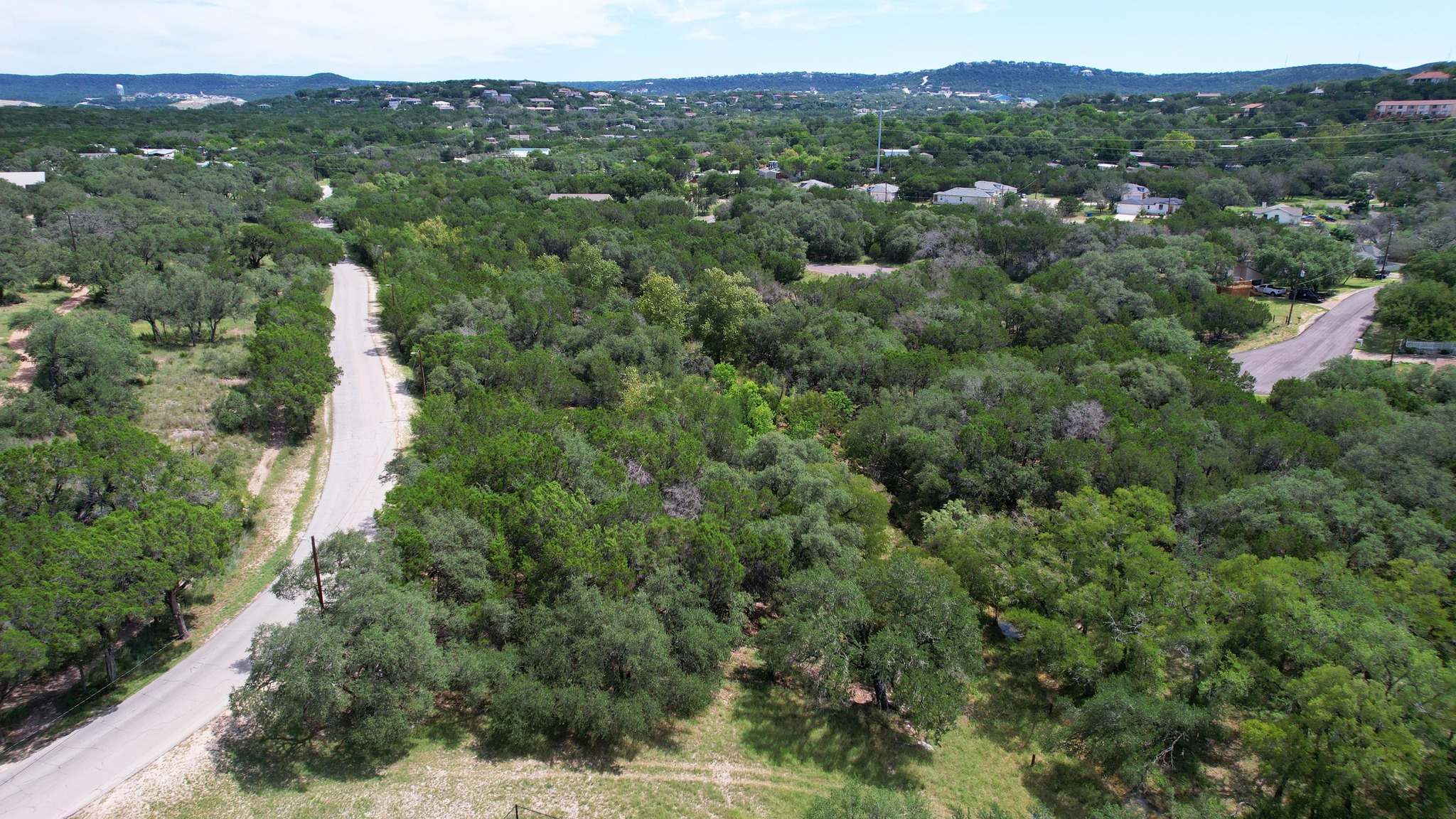 6719 Bar K Ranch Road Lago Vista, TX 78645 - Photo 8 of 36 an aerial view of residential houses with outdoor space and trees