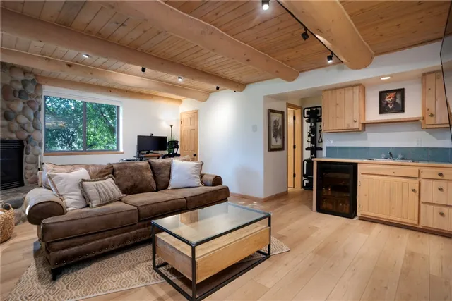 a living room with kitchen island furniture and a kitchen view