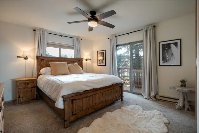 a spacious bedroom with a large bed and a large window