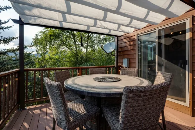 a view of city from a dining room with furniture window and outside view