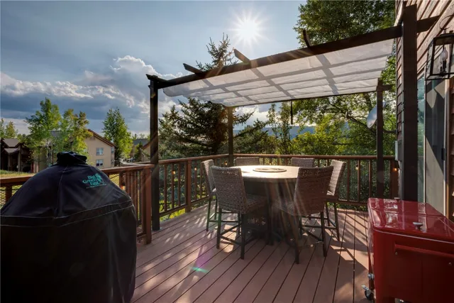 a view of balcony with furniture and wooden deck