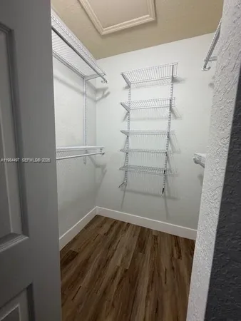a white toilet sitting next to a bath tub