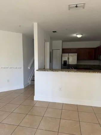 a view of a kitchen with a sink
