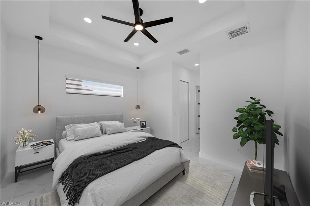 1138 Garibaldi Street East Lehigh Acres, FL 33974 - Photo 13 of 36 Bedroom featuring light marble finish floors, a tray ceiling, a ceiling fan, and recessed lighting