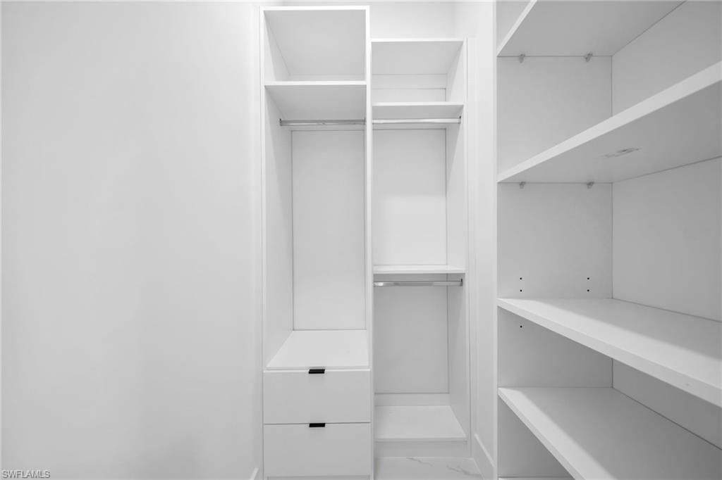 1138 Garibaldi Street East Lehigh Acres, FL 33974 - Photo 24 of 36 Walk in closet featuring marble look tile flooring