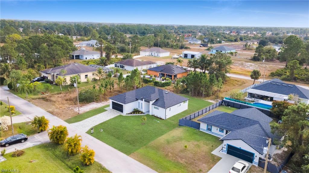 1138 Garibaldi Street East Lehigh Acres, FL 33974 - Photo 5 of 36 Aerial perspective of suburban area
