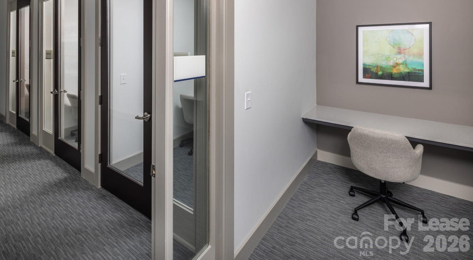 8424 North Tryon Street, Unit A2 Charlotte, NC 28262 - Photo 9 of 25 a view of a workspace with furniture and a window