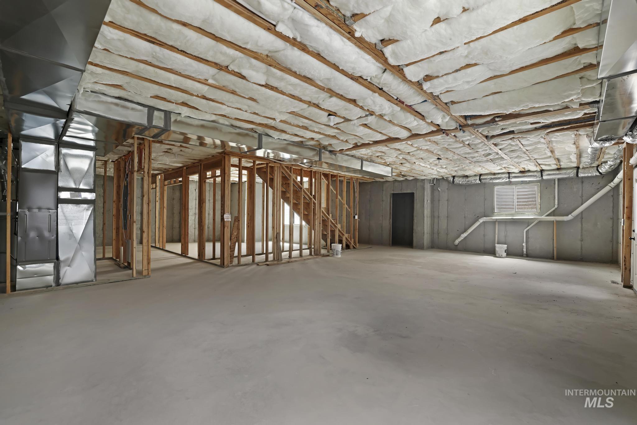 866 Quartz Road Kimberly, ID 83341 - Photo 41 of 48 Unfinished lower level featuring exposed ceiling insulation, concrete flooring, and structural framing