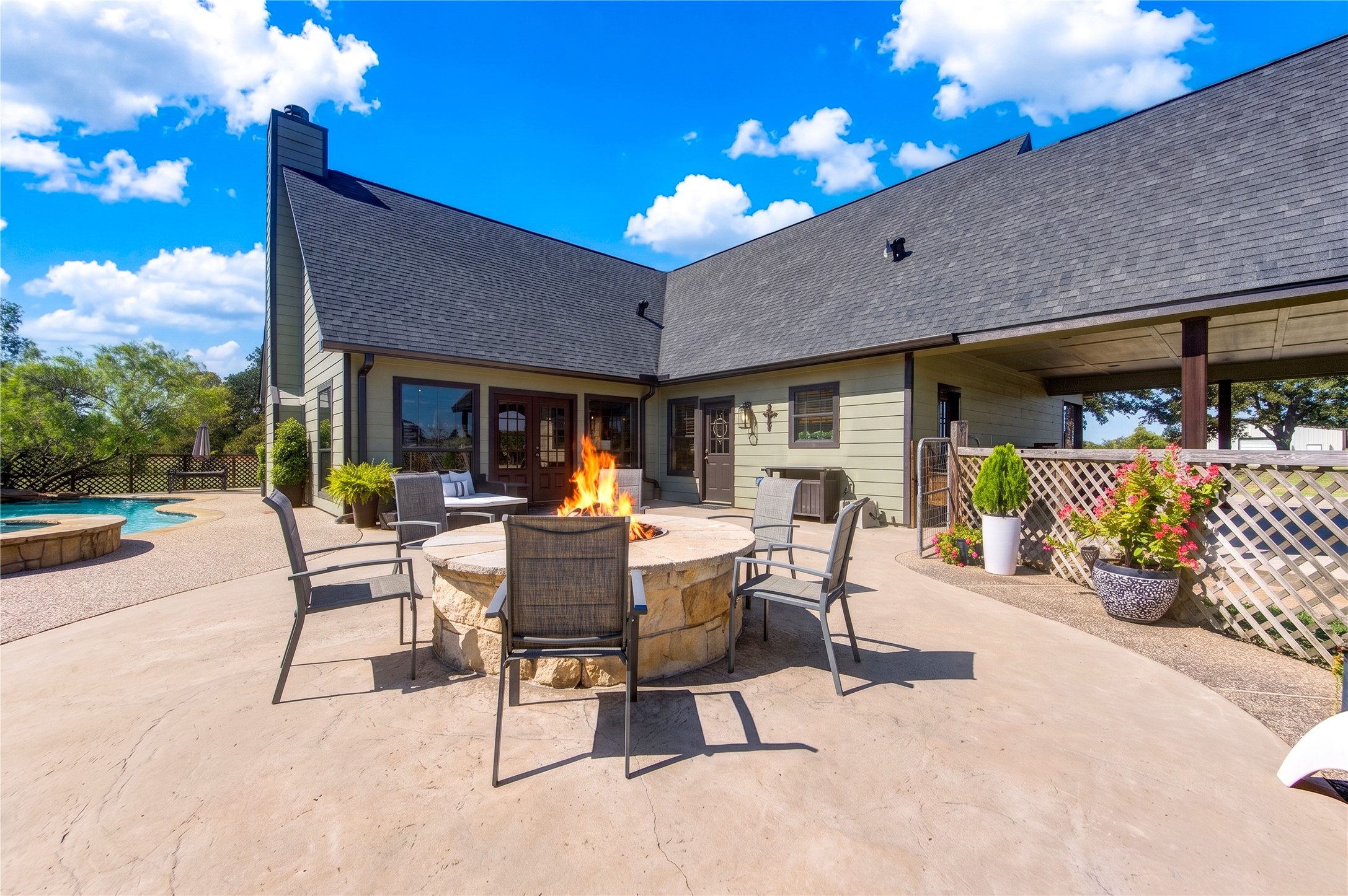 22313 Chapman Road Hempstead, TX 77445 - Photo 37 of 50 The limestone firepit is a perfect addition providing warmth and ambiance in the colder months.