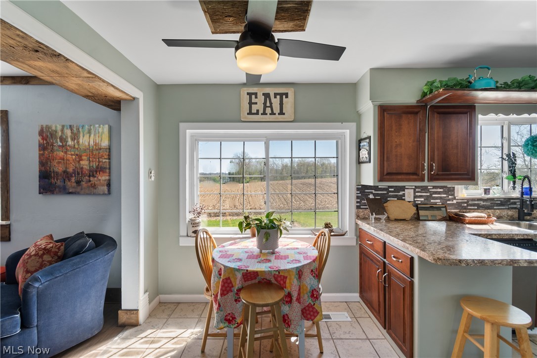 5261 Dailey Road New Franklin, OH 44319 - Photo 8 of 48 Enjoy the view and your coffee while sitting in the dining area of the kitchen