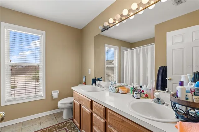 a bedroom with a bed a desk and chair