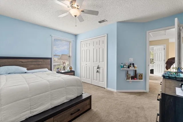 an aerial view of residential houses with outdoor space and river