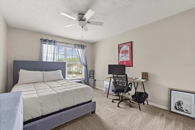 an aerial view of a house with a yard and lake view