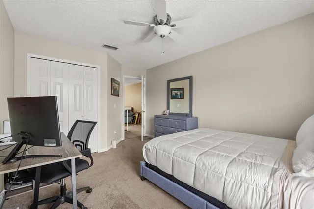 an aerial view of multiple houses with yard