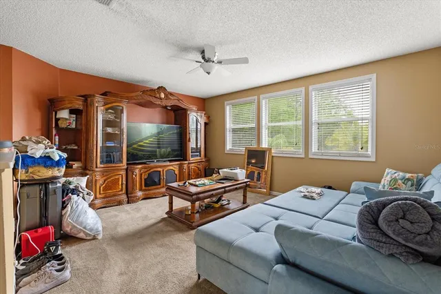 an aerial view of a house with a yard and a fence