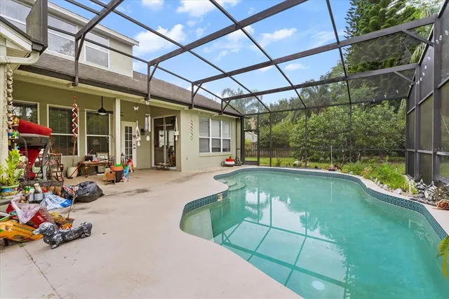 a bathroom with a granite countertop tub sink a mirror and a bathtub