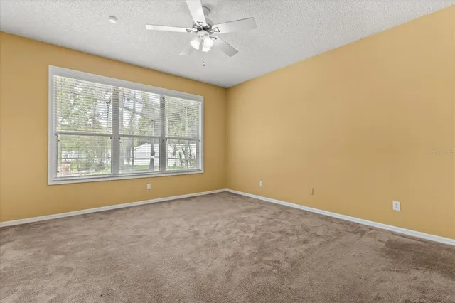 a kitchen with stainless steel appliances granite countertop a stove top oven a sink a counter top space and cabinets