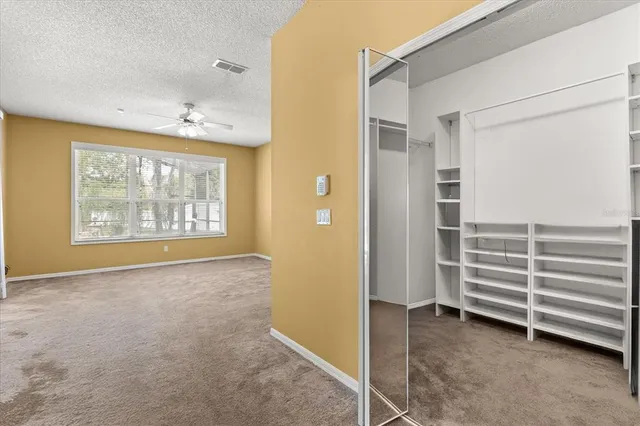a kitchen with stainless steel appliances granite countertop a refrigerator and a stove
