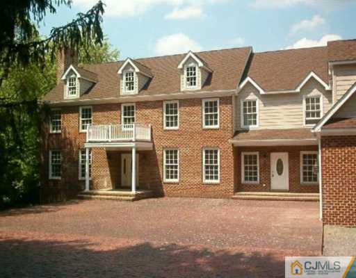 972 Ridge Road Monmouth Junction, NJ 08852 - Photo 1 of 2 a front view of a house with a road