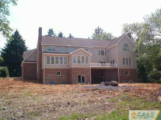 972 Ridge Road Monmouth Junction, NJ 08852 - Photo 2 of 2 a front view of a house with a yard