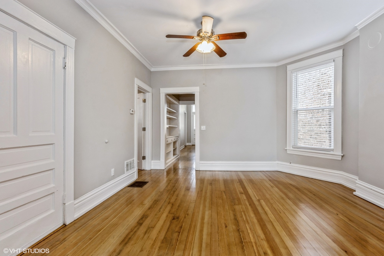 2622 West Crystal Street, Unit 2 Chicago, IL 60622 - Photo 2 of 10 wooden floor in an empty room with a window