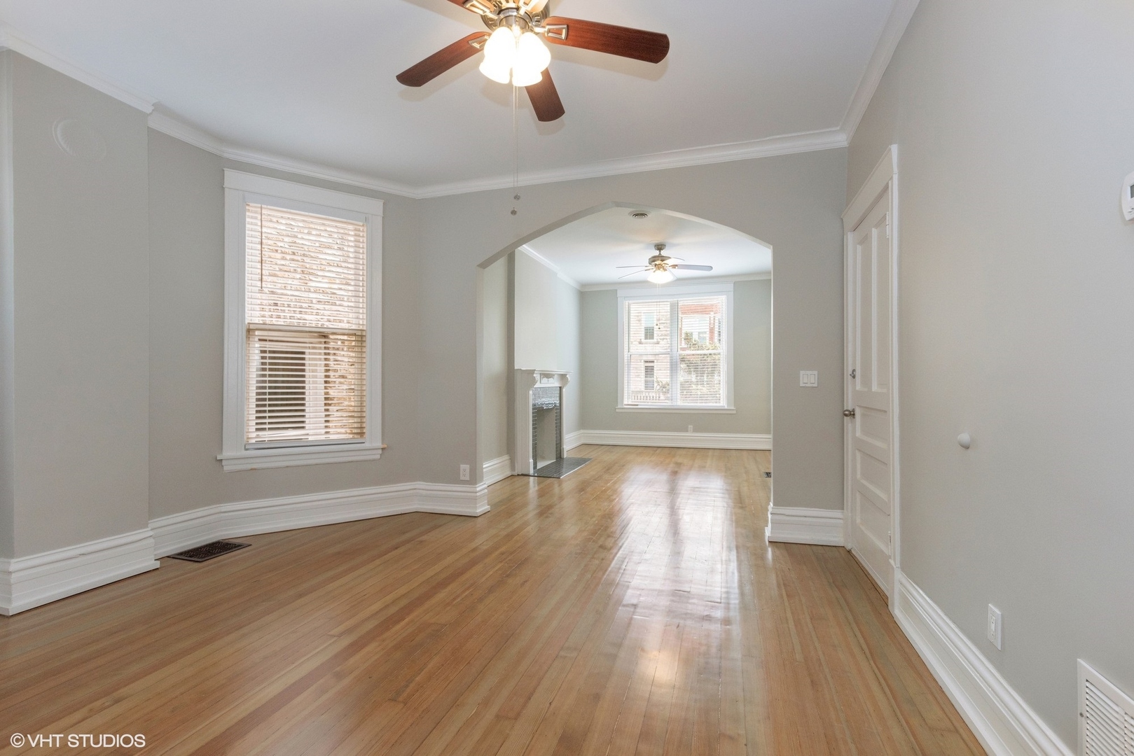2622 West Crystal Street, Unit 2 Chicago, IL 60622 - Photo 3 of 10 a view of empty room with wooden floor and fan
