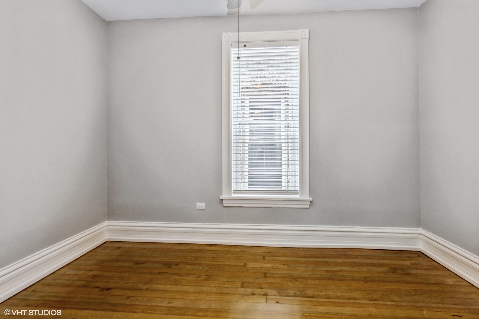 2622 West Crystal Street, Unit 2 Chicago, IL 60622 - Photo 9 of 10 a view of empty room with wooden floor and fan