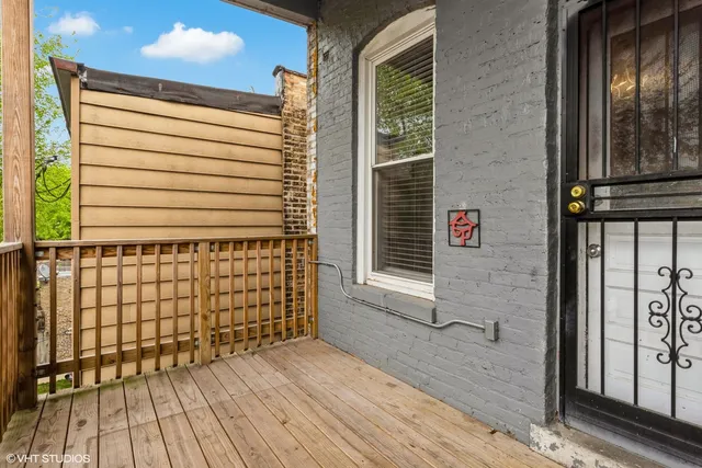a view of a door and wooden floor