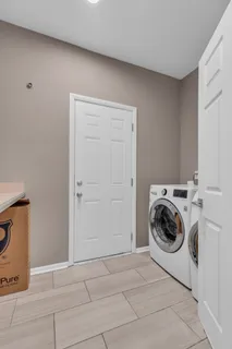 a bathroom with a toilet a sink and vanity