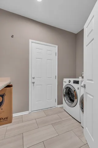 a bathroom with a toilet a sink and vanity