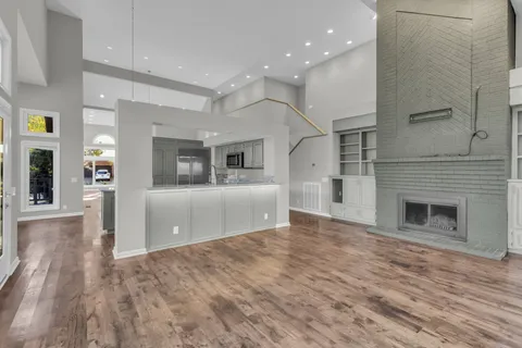 a view of kitchen with furniture and wooden floor