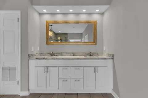 a bathroom with a bathtub and shower