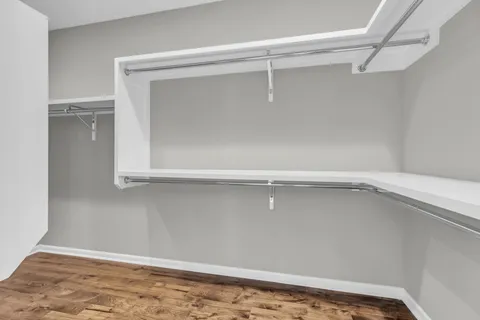 an empty room with a empty space and windows