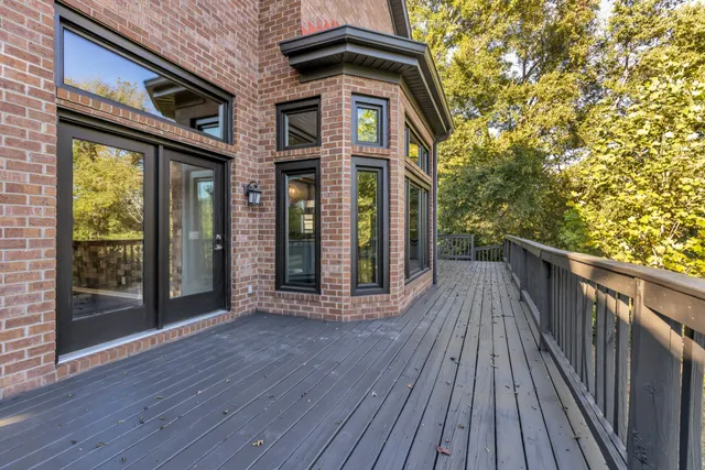 a view of a balcony with wooden floor