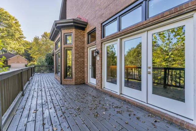 a balcony with wooden floor