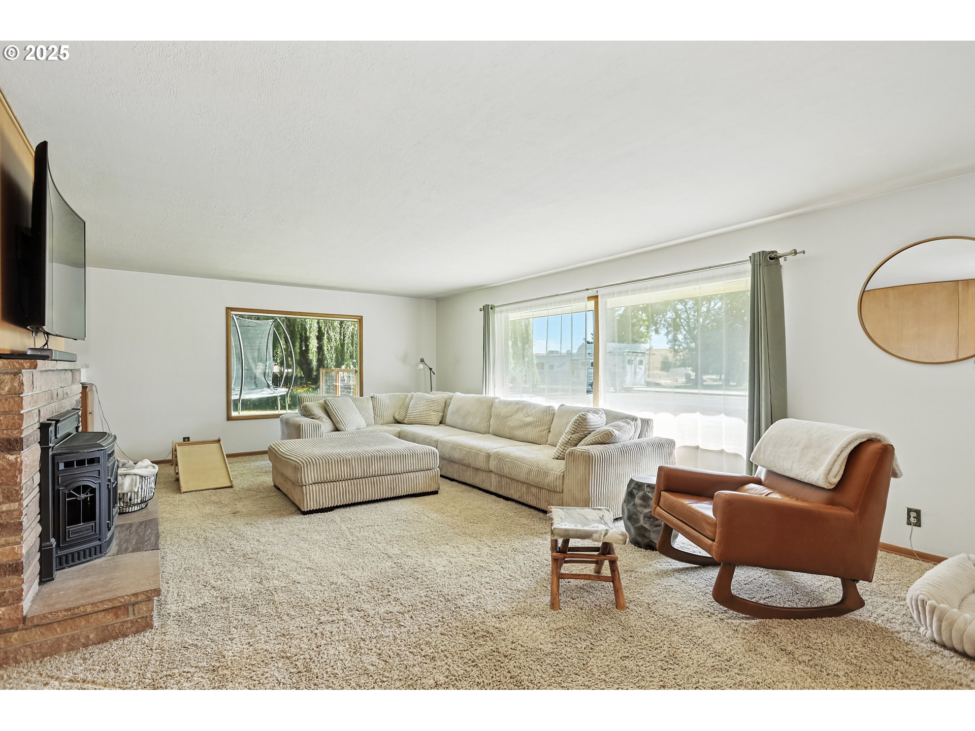236 N Mill Grass Valley, OR 97029 - Photo 12 of 45 a living room with furniture a flat screen tv and a window