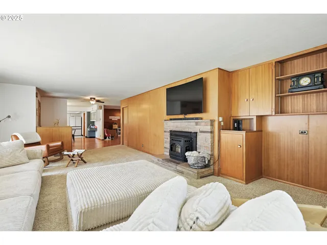 a bedroom with a bed and a television