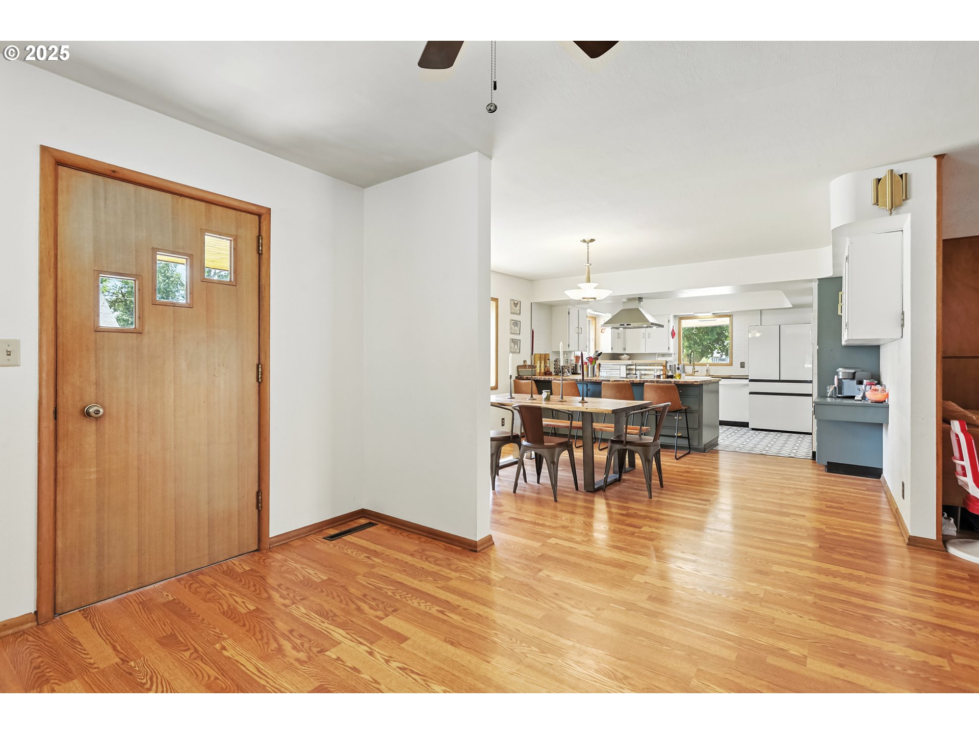 236 N Mill Grass Valley, OR 97029 - Photo 16 of 45 a view of kitchen and dining room with furniture wooden floor