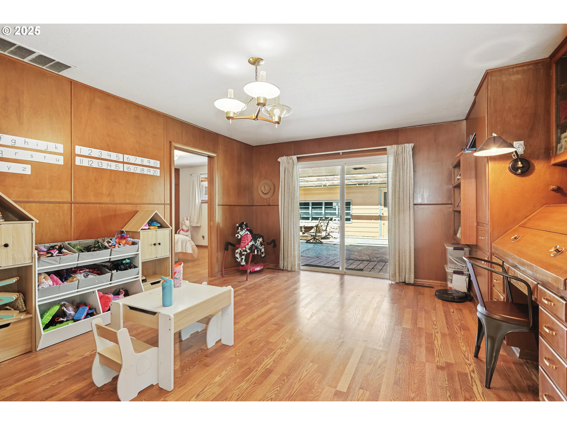 236 N Mill Grass Valley, OR 97029 - Photo 18 of 45 a living room with furniture a flat screen tv and a window
